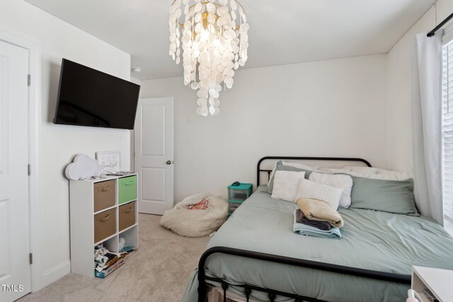 404 Porterfield Dr, Youngsville, NC 27596 - carpeted bedroom featuring a chandelier