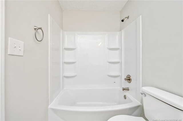 6313 Belle Terre Ct, Fayetteville, NC 28304 - full bathroom with toilet, a textured ceiling, and shower / bathtub combination