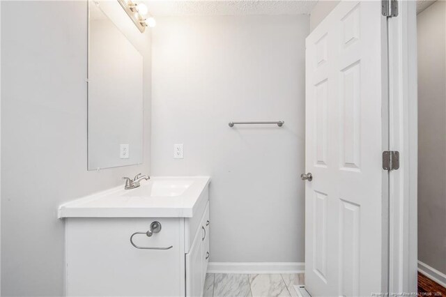 6313 Belle Terre Ct, Fayetteville, NC 28304 - bathroom featuring vanity, marble finish floors, and baseboards