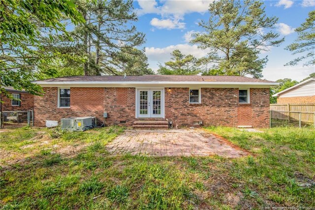 6313 Belle Terre Ct, Fayetteville, NC 28304 - back of house with french doors, a patio, brick siding, central air condition unit, and entry steps