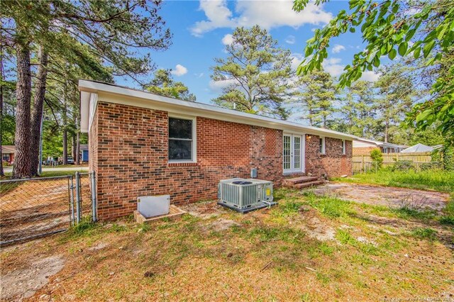 6313 Belle Terre Ct, Fayetteville, NC 28304 - rear view of property featuring central AC, brick siding, french doors, a gate, and entry steps