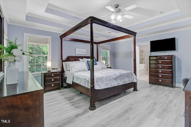 1128 Neuse Ridge Dr, Clayton, NC 27527 - bedroom featuring light wood finished floors, a raised ceiling, ensuite bathroom, crown molding, and ceiling fan