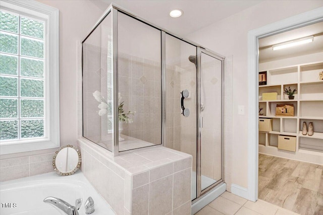 1128 Neuse Ridge Dr, Clayton, NC 27527 - bathroom featuring a stall shower, a garden tub, tile patterned flooring, and recessed lighting
