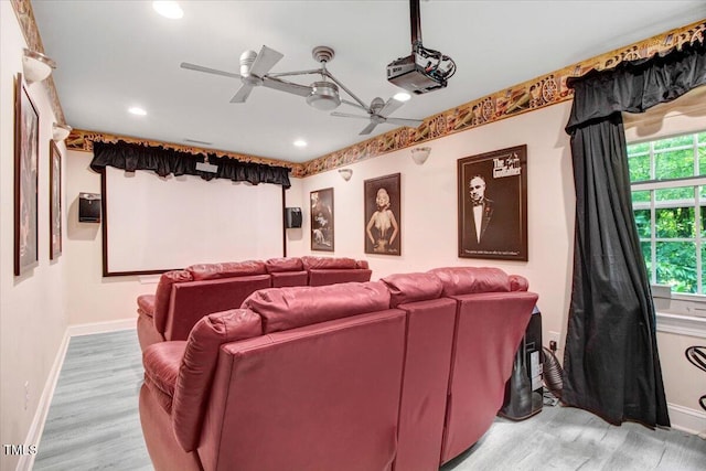 1128 Neuse Ridge Dr, Clayton, NC 27527 - cinema room with light wood finished floors, a ceiling fan, recessed lighting, and baseboards