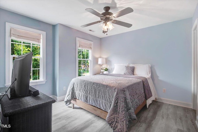 1128 Neuse Ridge Dr, Clayton, NC 27527 - bedroom featuring wood finished floors, baseboards, and a ceiling fan