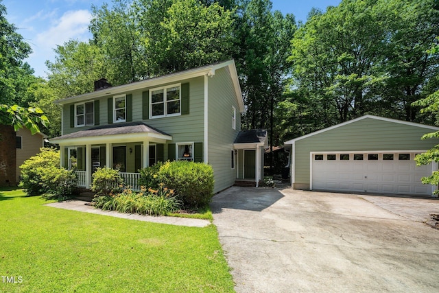 1006 Apache Ln, Apex, NC 27502 - view of front facade featuring a porch, a front lawn, a chimney, an outdoor structure, and a detached garage