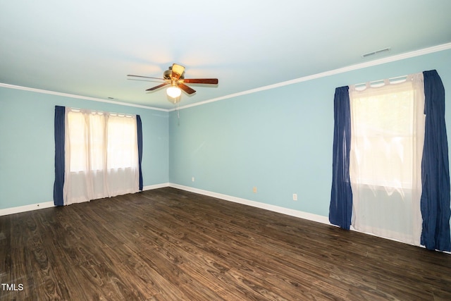 1006 Apache Ln, Apex, NC 27502 - empty room featuring ceiling fan, baseboards, dark wood-type flooring, and crown molding