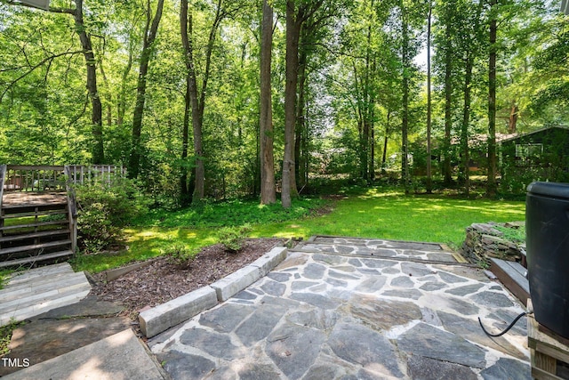 1006 Apache Ln, Apex, NC 27502 - view of green lawn with a wooden deck and a patio