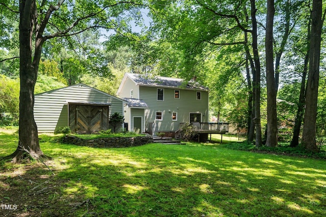 1006 Apache Ln, Apex, NC 27502 - back of property featuring a lawn and a wooden deck