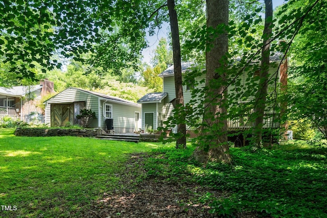 1006 Apache Ln, Apex, NC 27502 - rear view of house featuring a yard and a wooden deck