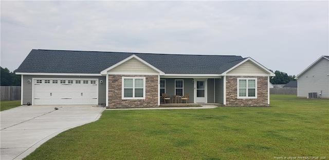 138 Canady Rd, Parkton, NC 28371 - craftsman-style home featuring stone siding, central AC, a porch, driveway, and an attached garage