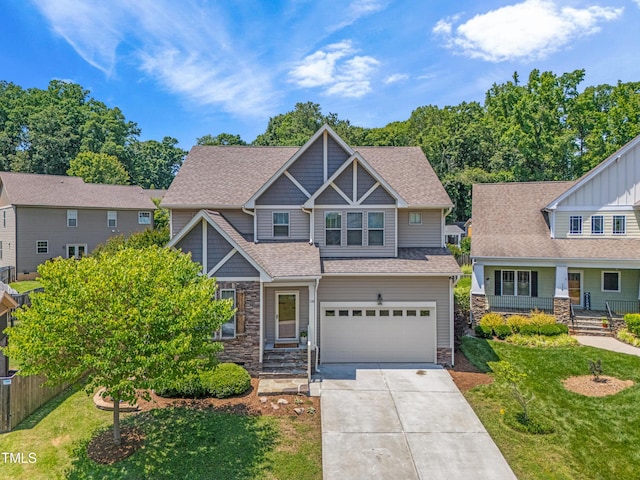 118 Fox Run Ct, Durham, NC 27705 - craftsman-style house featuring a garage, stone siding, concrete driveway, and a shingled roof