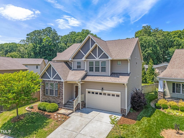 118 Fox Run Ct, Durham, NC 27705 - craftsman-style home with a garage, a shingled roof, driveway, and stone siding
