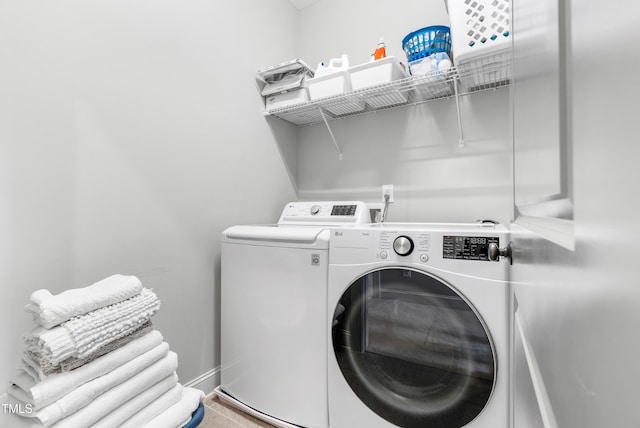 118 Fox Run Ct, Durham, NC 27705 - laundry area featuring separate washer and dryer, baseboards, and tile patterned floors