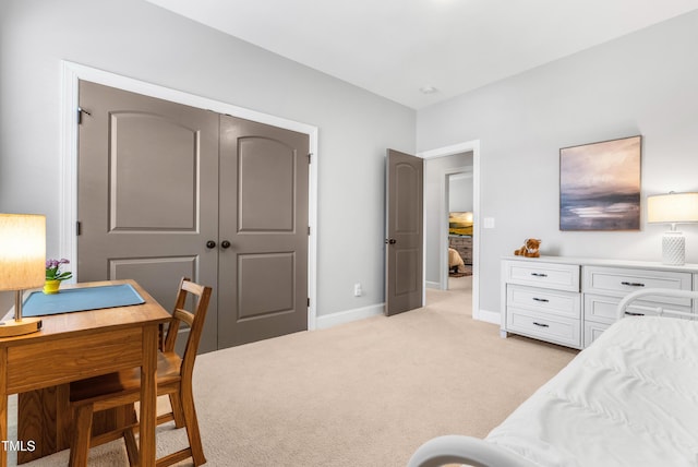 118 Fox Run Ct, Durham, NC 27705 - bedroom featuring light colored carpet, an office area, baseboards, and a closet
