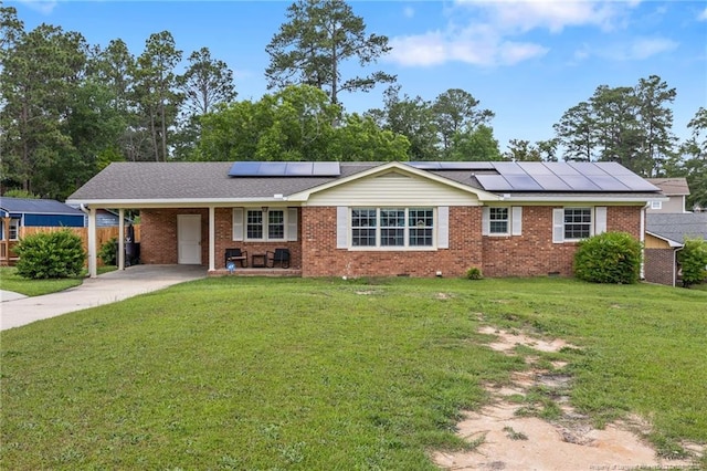 701 Dandridge Dr, Fayetteville, NC 28304 - single story home with concrete driveway, a front lawn, brick siding, an attached carport, and solar panels