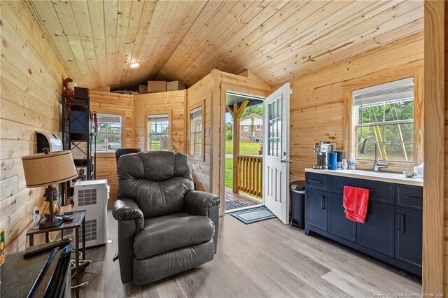 701 Dandridge Dr, Fayetteville, NC 28304 - sitting room featuring lofted ceiling, wooden walls, light wood-style flooring, wooden ceiling, and heating unit