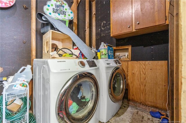 701 Dandridge Dr, Fayetteville, NC 28304 - washroom featuring washer and clothes dryer and cabinet space