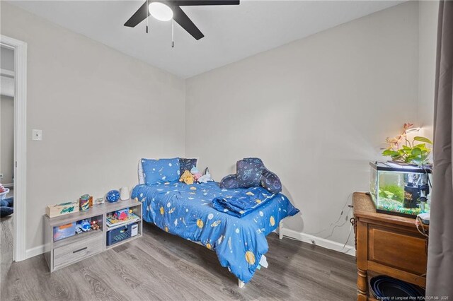 701 Dandridge Dr, Fayetteville, NC 28304 - bedroom with wood finished floors, baseboards, and ceiling fan