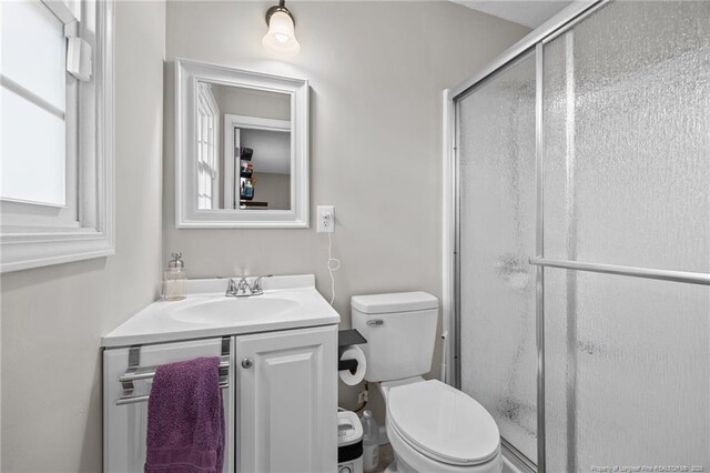 701 Dandridge Dr, Fayetteville, NC 28304 - bathroom with toilet, a stall shower, and vanity