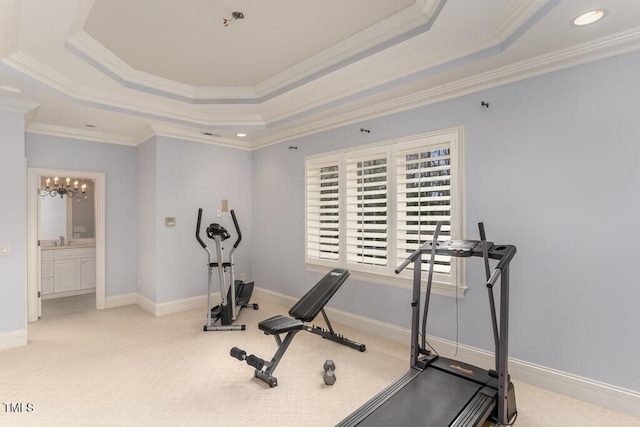 166 Bonica Creek Dr, Garner, NC 27529 - workout area featuring a raised ceiling, a chandelier, carpet, crown molding, and a sink
