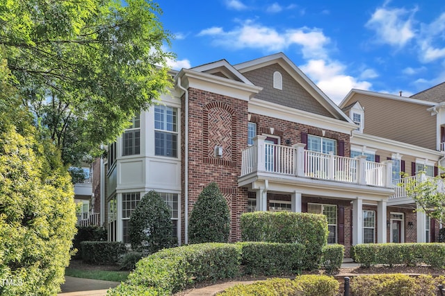 10511 Sablewood Dr Unit 107, Raleigh, NC 27617 - view of front facade featuring brick siding and a balcony