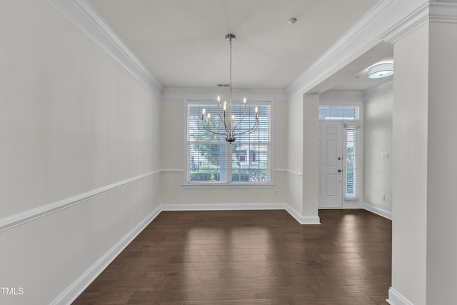 10511 Sablewood Dr Unit 107, Raleigh, NC 27617 - unfurnished dining area with dark wood-type flooring, ornamental molding, and a chandelier