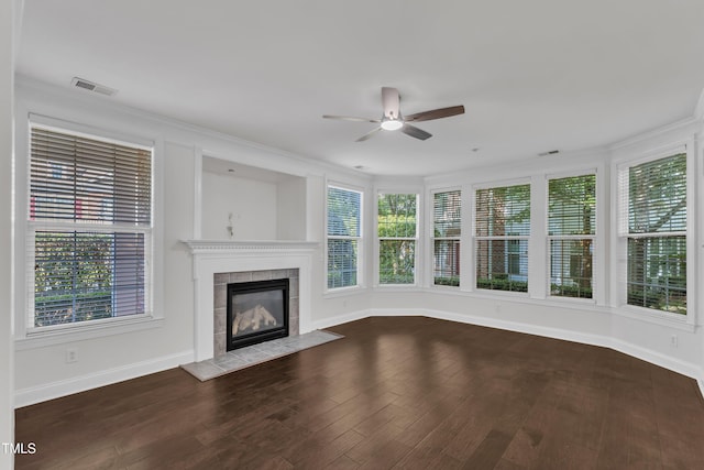 10511 Sablewood Dr Unit 107, Raleigh, NC 27617 - unfurnished living room featuring a ceiling fan, a tiled fireplace, and wood finished floors
