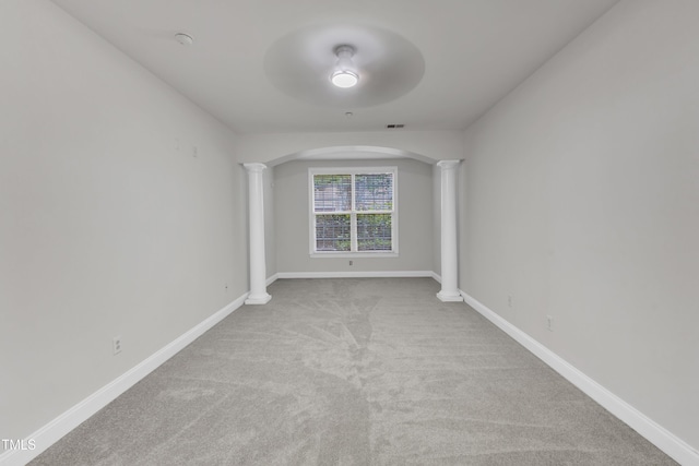 10511 Sablewood Dr Unit 107, Raleigh, NC 27617 - empty room featuring decorative columns, arched walkways, and carpet