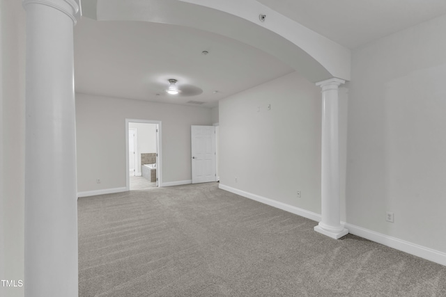 10511 Sablewood Dr Unit 107, Raleigh, NC 27617 - empty room with ornate columns, arched walkways, carpet floors, and fire sprinkler in ceiling