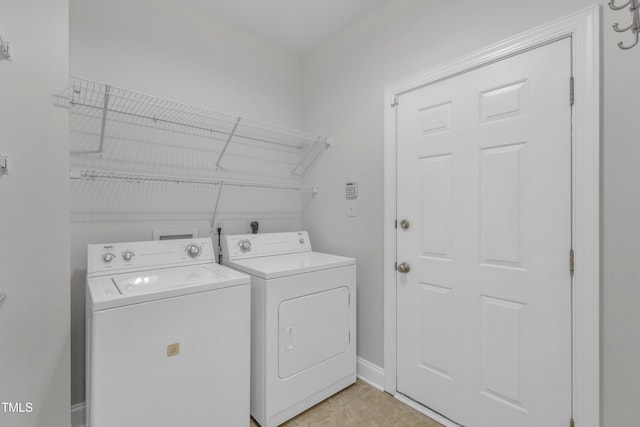 10511 Sablewood Dr Unit 107, Raleigh, NC 27617 - washroom with independent washer and dryer and light tile patterned floors