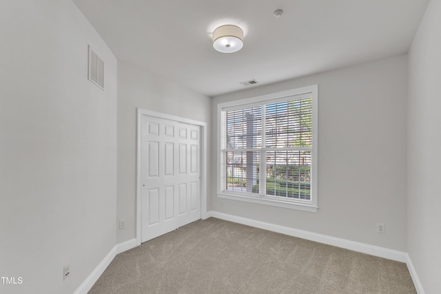 10511 Sablewood Dr Unit 107, Raleigh, NC 27617 - unfurnished bedroom featuring carpet flooring and a closet