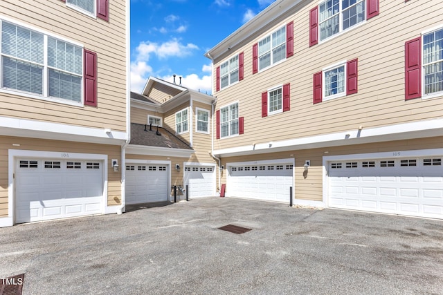 10511 Sablewood Dr Unit 107, Raleigh, NC 27617 - exterior space featuring driveway and an attached garage