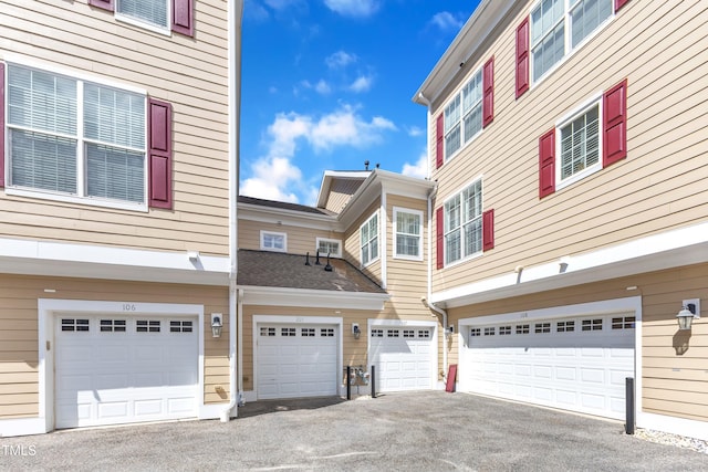 10511 Sablewood Dr Unit 107, Raleigh, NC 27617 - view of side of property featuring an attached garage and driveway