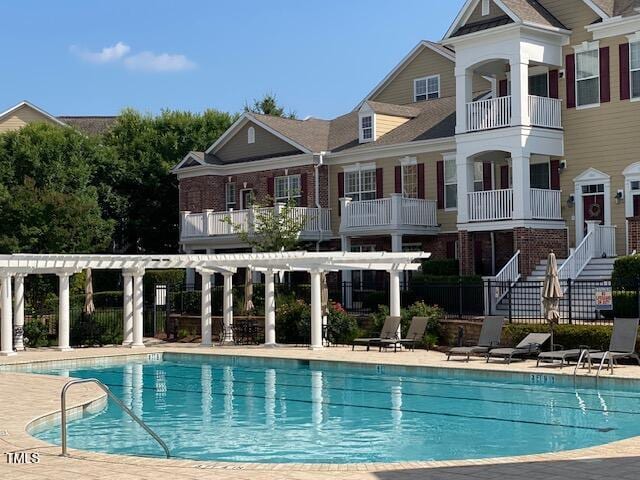 10511 Sablewood Dr Unit 107, Raleigh, NC 27617 - community pool featuring a pergola and a patio