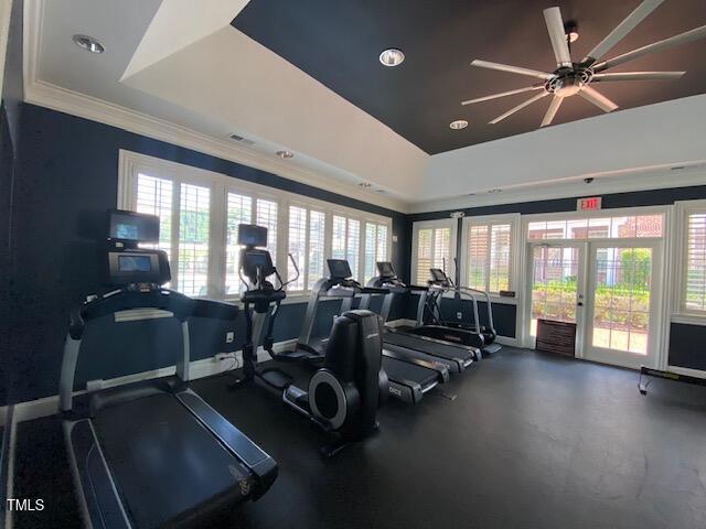 10511 Sablewood Dr Unit 107, Raleigh, NC 27617 - gym with crown molding, a tray ceiling, ceiling fan, recessed lighting, and french doors