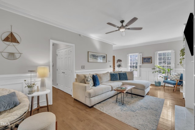 1905 Indianwood Ct, Raleigh, NC 27604 - living area with crown molding, a ceiling fan, wainscoting, and wood finished floors