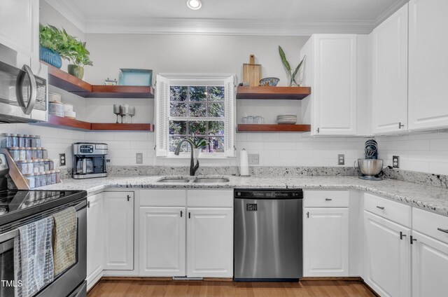 1905 Indianwood Ct, Raleigh, NC 27604 - kitchen featuring stainless steel appliances, open shelves, a sink, backsplash, and white cabinetry