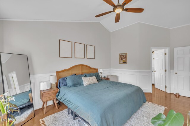1905 Indianwood Ct, Raleigh, NC 27604 - bedroom with wainscoting, crown molding, wood finished floors, vaulted ceiling, and a ceiling fan