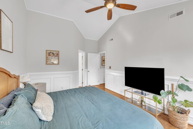 1905 Indianwood Ct, Raleigh, NC 27604 - bedroom featuring wood finished floors, a wainscoted wall, ceiling fan, lofted ceiling, and crown molding