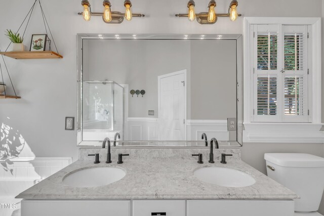 1905 Indianwood Ct, Raleigh, NC 27604 - full bathroom with double vanity, toilet, and a stall shower