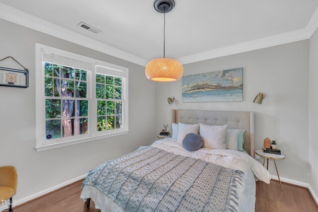 1905 Indianwood Ct, Raleigh, NC 27604 - bedroom with baseboards, ornamental molding, and wood finished floors