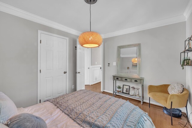 1905 Indianwood Ct, Raleigh, NC 27604 - bedroom featuring crown molding, wood finished floors, and baseboards