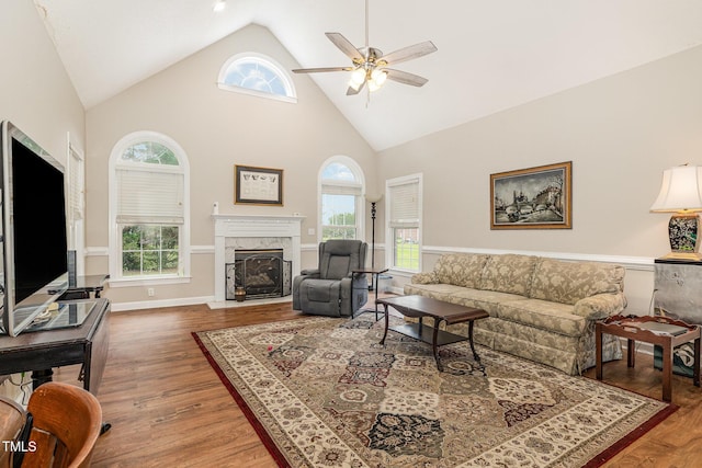 110 Windyfield Dr, Goldsboro, NC 27530 - living room featuring a ceiling fan, a fireplace, wood finished floors, and high vaulted ceiling