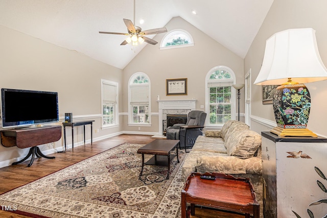110 Windyfield Dr, Goldsboro, NC 27530 - living room featuring ceiling fan, wood finished floors, healthy amount of natural light, a high end fireplace, and high vaulted ceiling