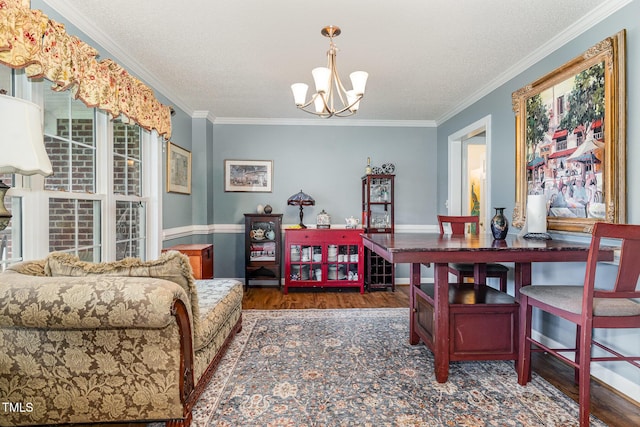110 Windyfield Dr, Goldsboro, NC 27530 - dining space with wood finished floors, a chandelier, crown molding, and a textured ceiling