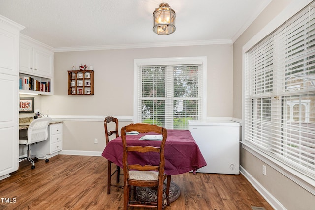 110 Windyfield Dr, Goldsboro, NC 27530 - dining space with crown molding, wood finished floors, and built in study area