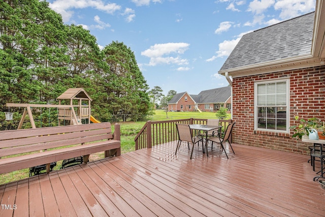 110 Windyfield Dr, Goldsboro, NC 27530 - wooden deck featuring outdoor dining space and a playground