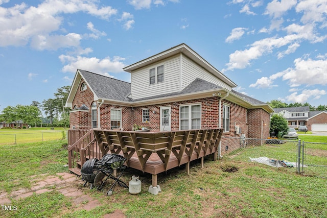 110 Windyfield Dr, Goldsboro, NC 27530 - rear view of house featuring brick siding, a fenced backyard, and a wooden deck