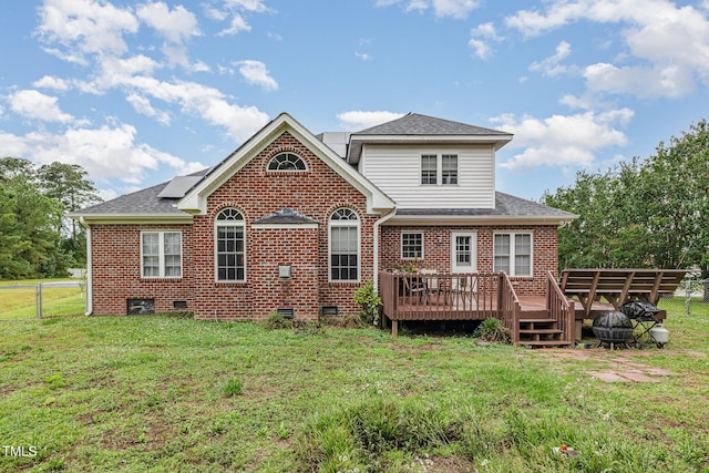110 Windyfield Dr, Goldsboro, NC 27530 - back of house featuring a deck, brick siding, roof with shingles, crawl space, and solar panels
